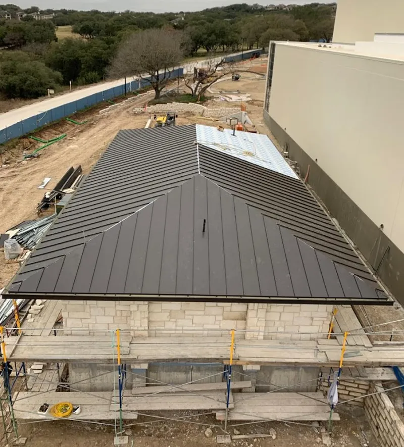 Metal roof new construction with scaffolding in Evans